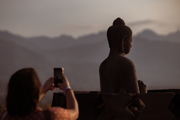 Borobudur Buddha facing sunset